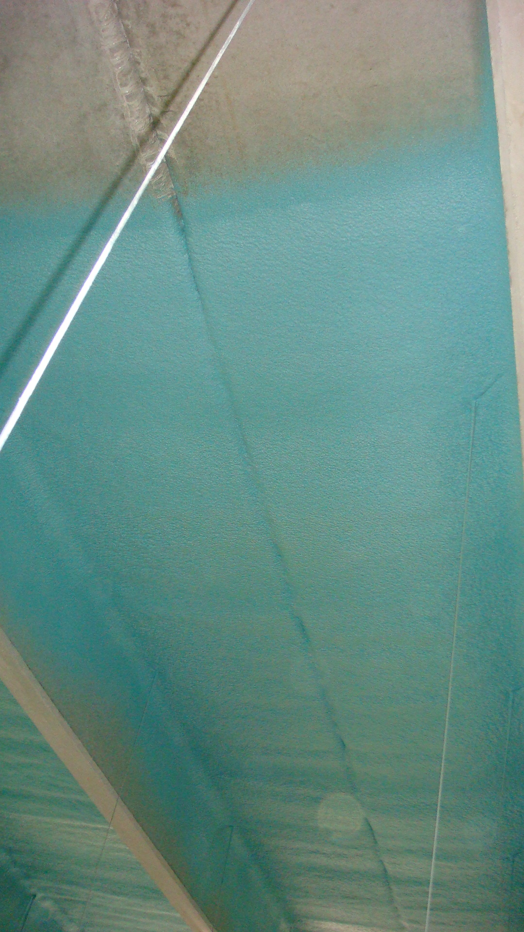 Protective polyurea coating applied to fabricated metal